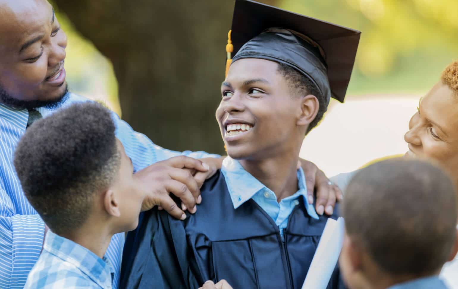 Student graduating with family support