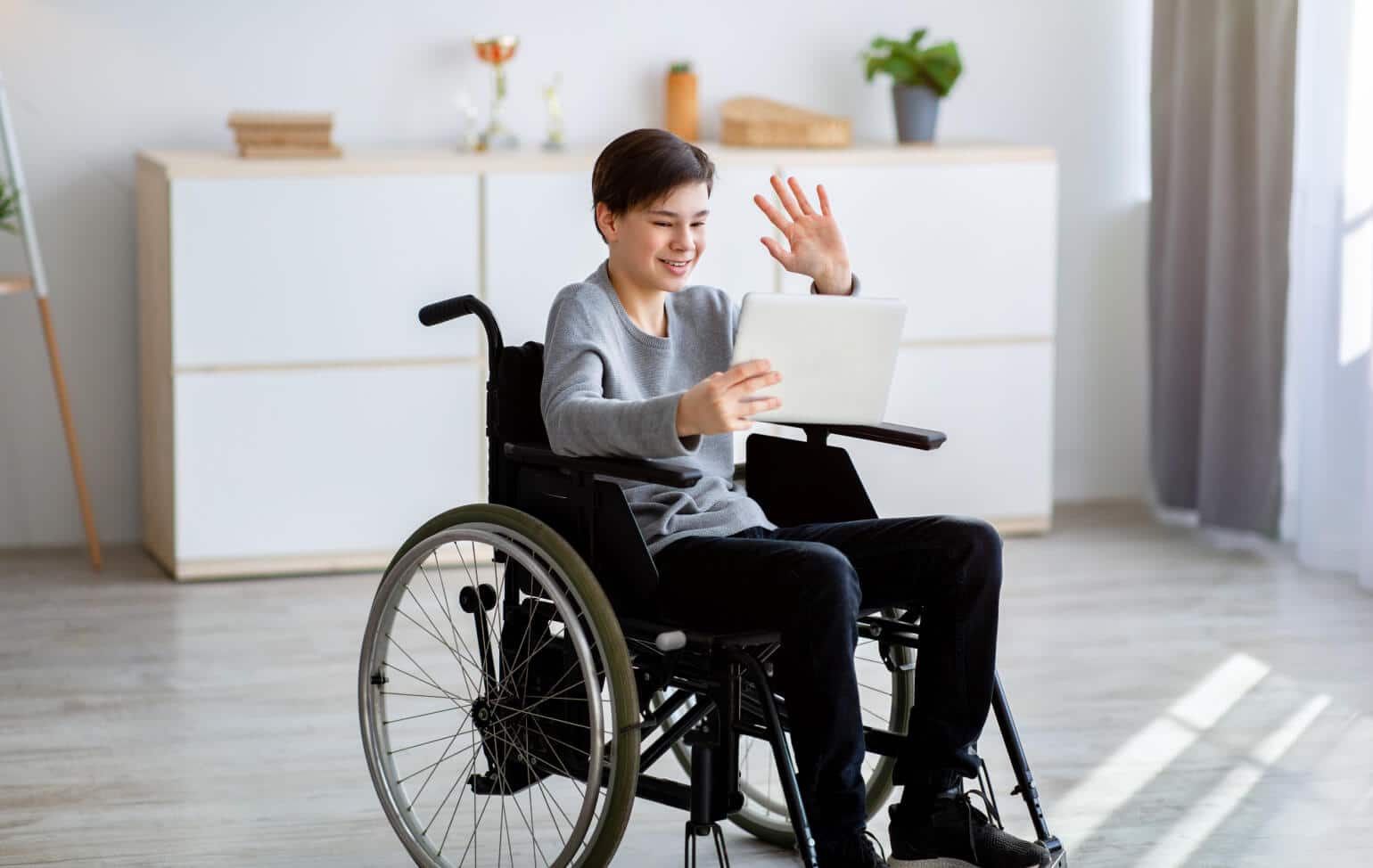 Student learning online in a wheelchair